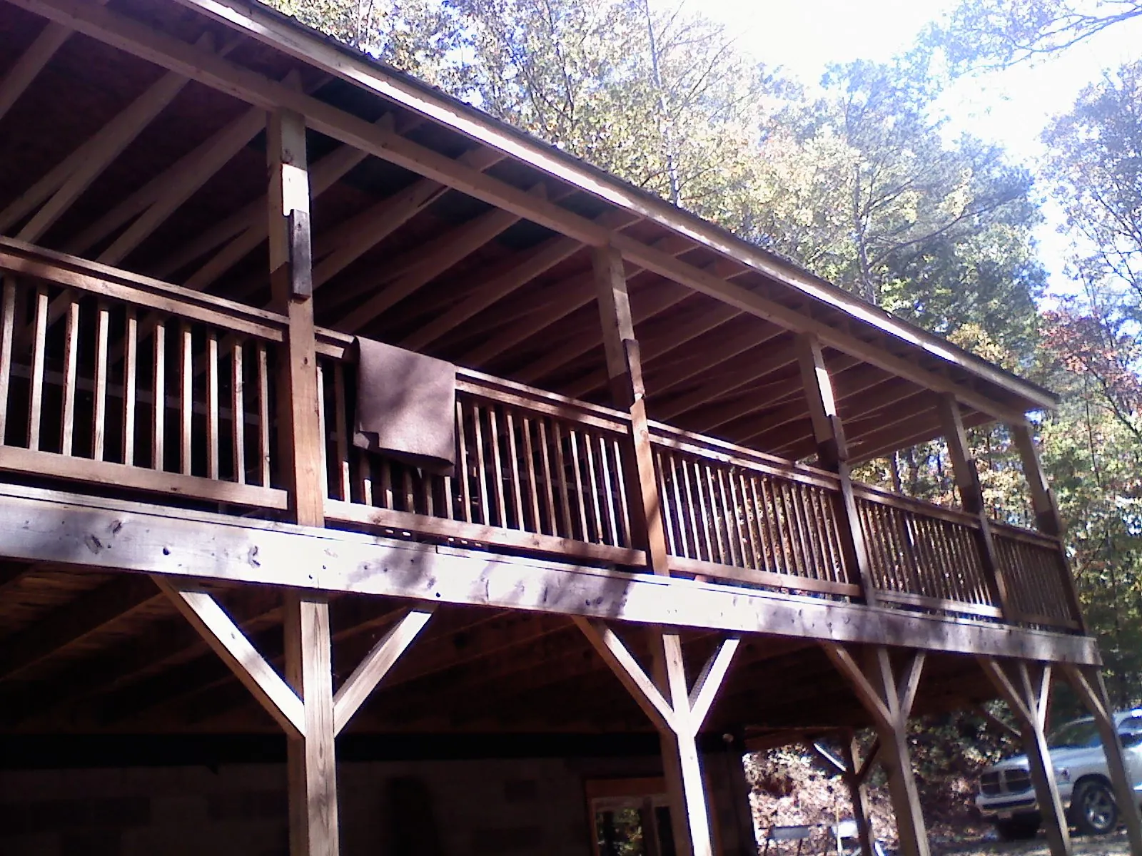 Timber framing under a new elevated porch and deck — Roof Leak Repair in Osage Beach by Roofing Brothers
